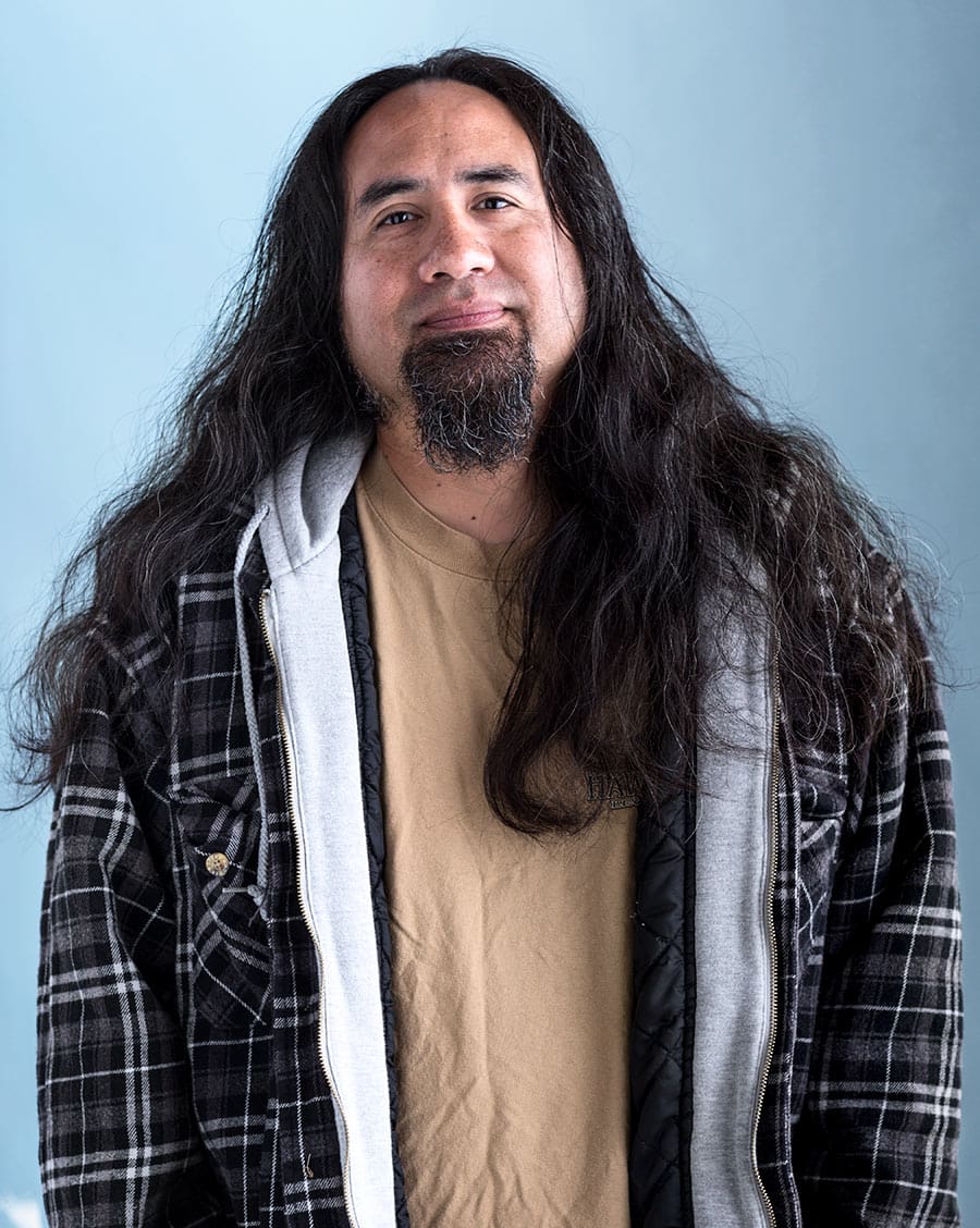 portrait of man with long hair and beard