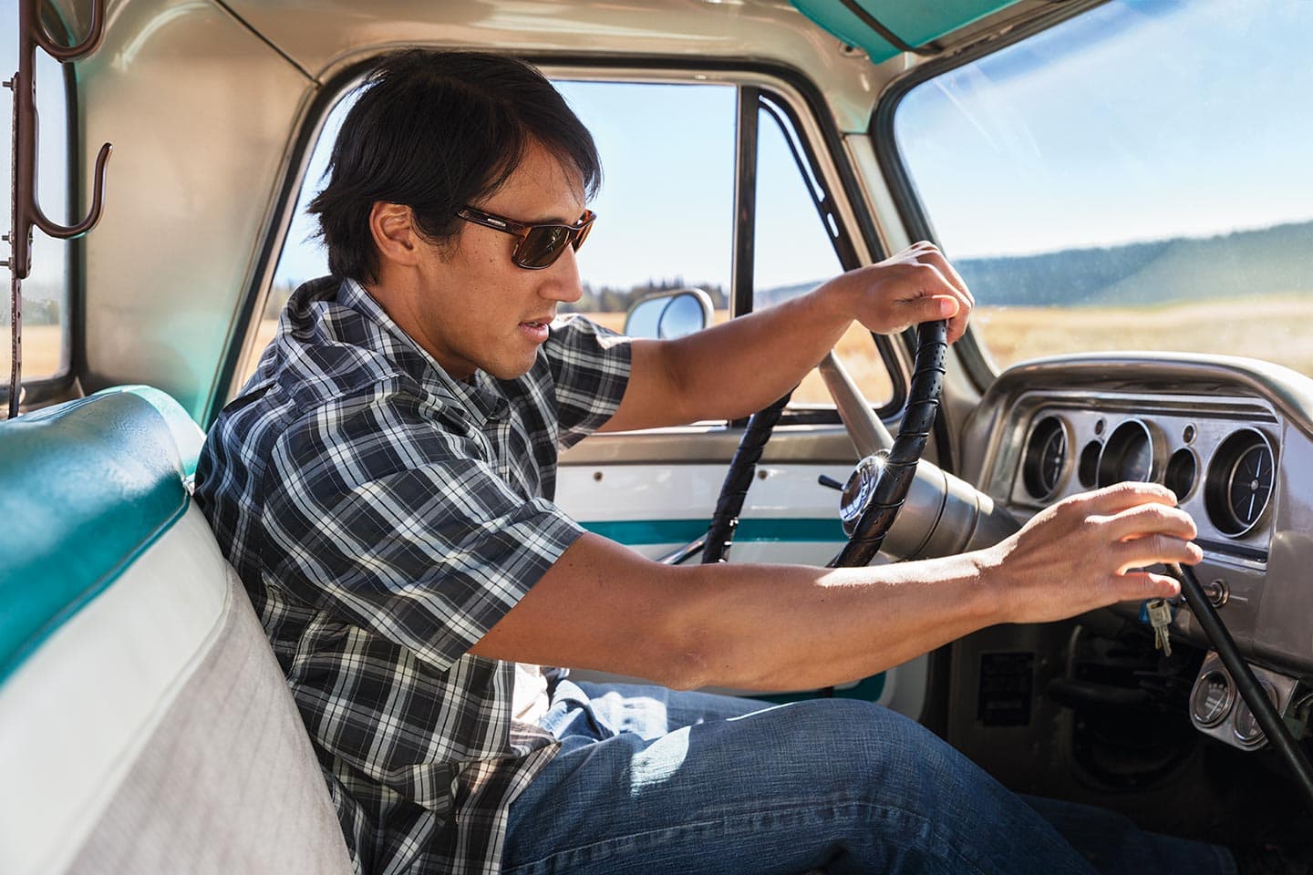Portrait of Man in Sunglasses Driving Truck Sunny Day