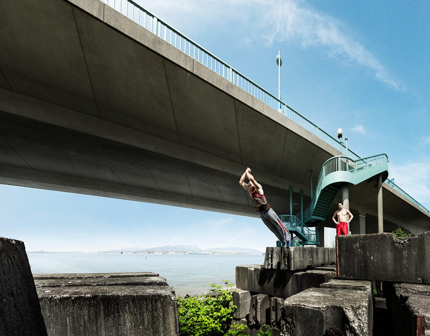 Two Athletic Men Parkour Wall Jump Gap Under Bridge