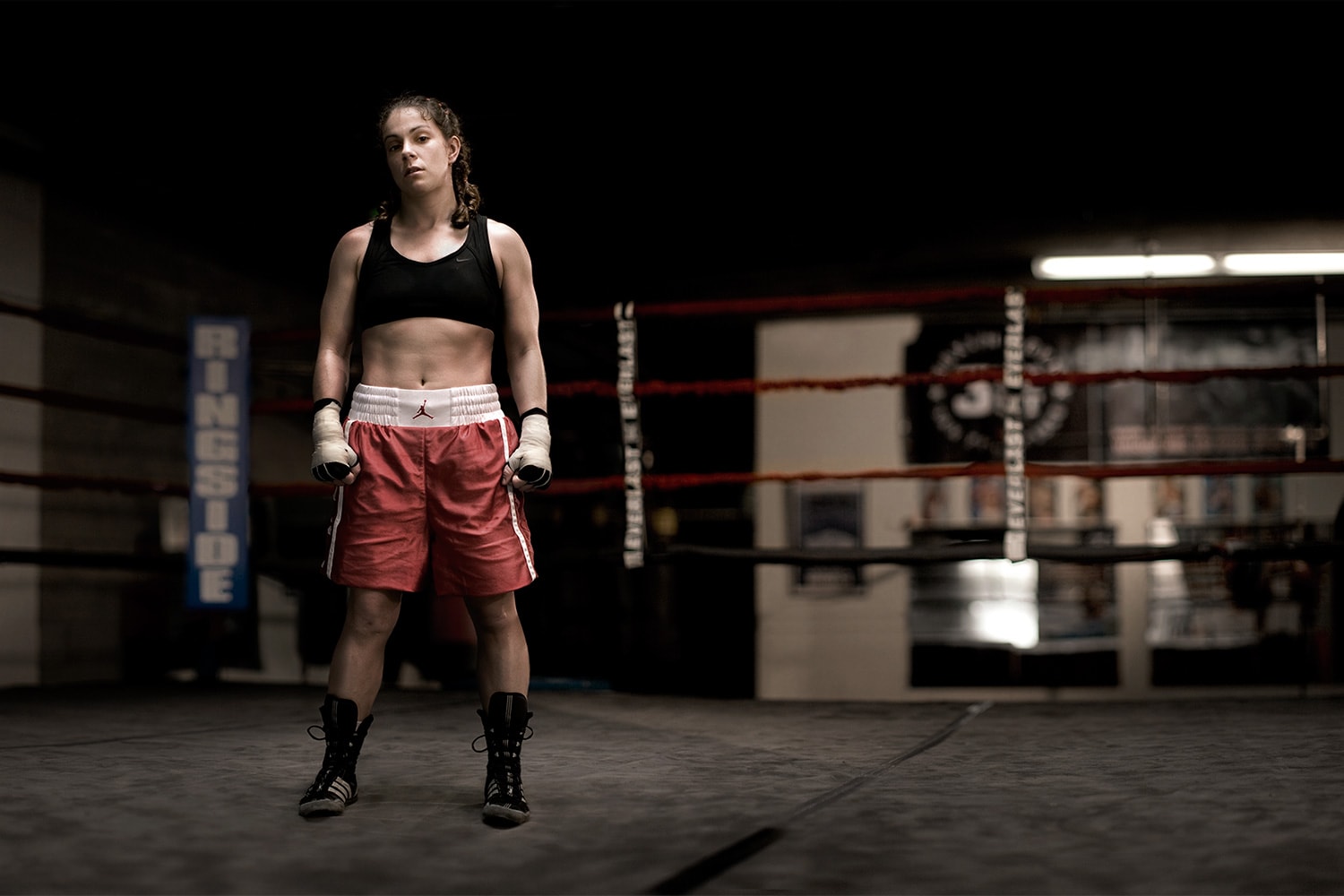 Athlete-female-boxer-standing-in-ring-Rod-McLean