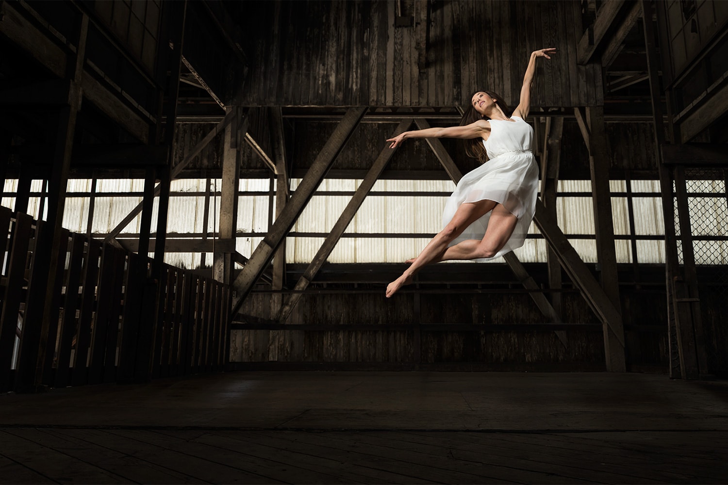 Female-Ballet-Ballerina-dancing-jumping-white-outfit-wood-warehouse-Rod-McLean