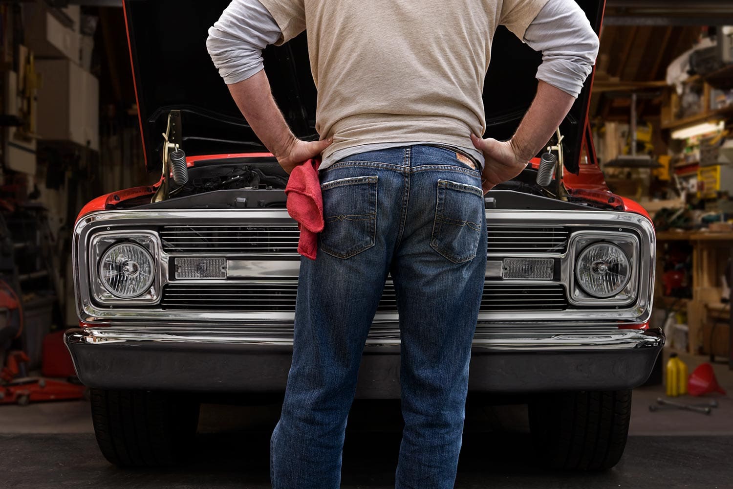 Man-fixing-red-truck-Rod-McLean